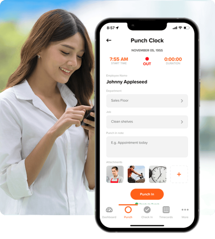 A smiling woman uses her phone beside a mobile app screen showing a nonprofit punch clock interface for tracking volunteer hours, with job and department details.